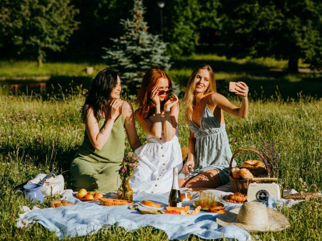 female friends relaxing having a picnic
